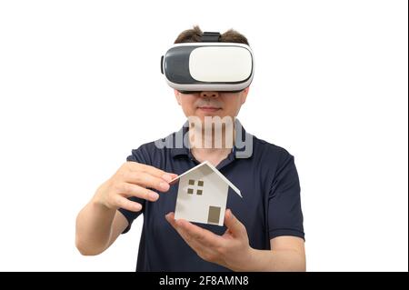 Man wearing virtual reality goggles. Studio shot, white background. Stock Photo