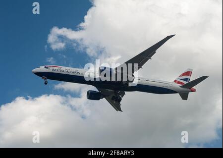 07.04.2021, Singapore, Republic of Singapore, Asia - A British Airways Boeing 777-300 ER passenger plane approaches Changi Airport for landing. Stock Photo