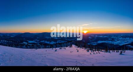 Picturesque winter panorama of snowy mountain hills Stock Photo
