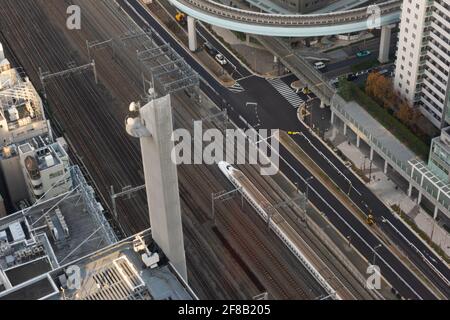 Tokyo, Japan - December 09, 2015: Elevated view of a passing Shinkansen train in Tokyo Japan Stock Photo