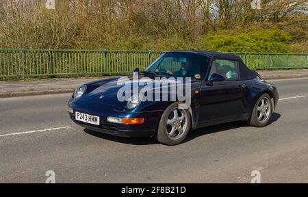 1996 90s nineties Porsche 911 Carrera Cabrio two-door 2+2 high-performance rear-engined sports car; Moving vehicles, cars, vehicle driving on UK roads, motors, motoring on the M6 English motorway road network Stock Photo