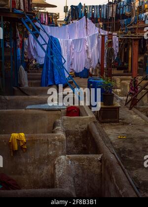 MUMBAI, INDIA - December 29, 2021:Dhobi Ghat is a well known open air laundromat in Mumbai. Laundry hanging in the open to dry. Stock Photo