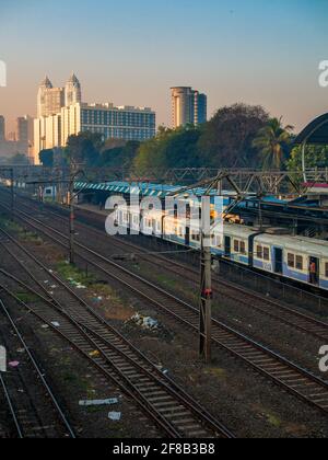 MUMBAI, INDIA - December 29, 2021: Mumbai local train transportation, one of the busiest commuter rail systems in the world hit by covide 19 pandemic Stock Photo