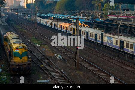 MUMBAI, INDIA - December 29, 2021: Mumbai local train transportation, one of the busiest commuter rail systems in the world hit by covide 19 pandemic Stock Photo