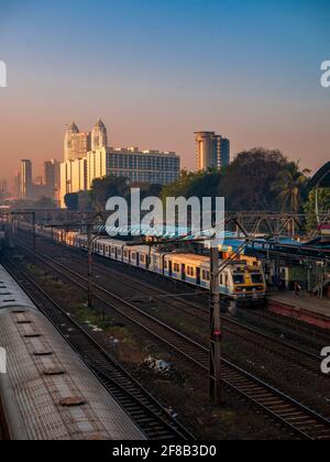MUMBAI, INDIA - December 29, 2021: Mumbai local train transportation, one of the busiest commuter rail systems in the world hit by covide 19 pandemic Stock Photo