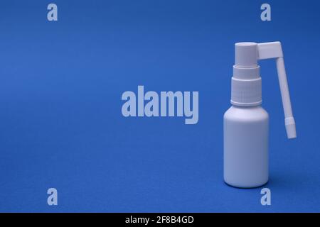 Gel spray for the oral cavity close-up on a blue background. mock up Stock Photo