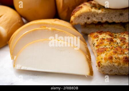 Cheese collection, Italian yellow smoked caciocavallo or scamorza cheese from Puglia Stock Photo