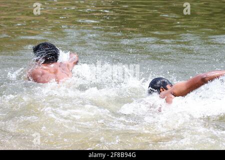 young man swimming Stock Photo