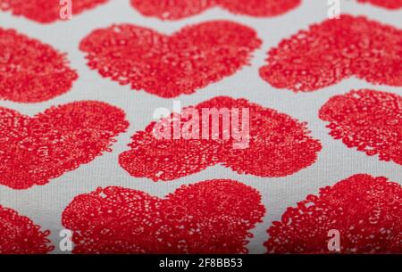heart sign pattern on cotton fabric background. print of red hearts, texture background, pattern, Stock Photo