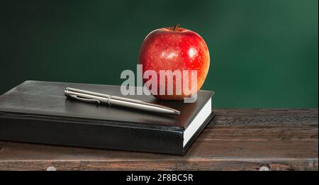 Healthy education concept with apple and book. Stock Photo