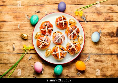 Easter hot cross buns and holiday decor.Easter baked goods Stock Photo