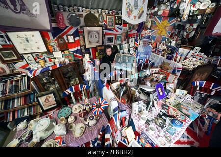 Anita Atkinson arranging the Queen and the Duke of Edinburgh's section of her royal memorabilia collection, one of the biggest in the world, at her home in Crook, County Durham. The 64 year old says she was devastated to hear the news of the death of Prince Philip. Picture date: Tuesday April 13, 2021. Stock Photo