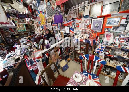 Anita Atkinson arranging the Queen and the Duke of Edinburgh's section of her royal memorabilia collection, one of the biggest in the world, at her home in Crook, County Durham. The 64 year old says she was devastated to hear the news of the death of Prince Philip. Picture date: Tuesday April 13, 2021. Stock Photo