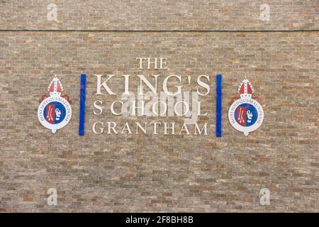 The Kings School Grantham, grammar school logo and sign on a brick wall. Grantham, Lincolnshire, England Stock Photo