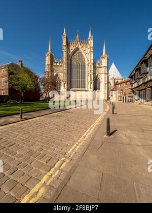 The Great East Window of York Minster seen from a deserted College Street, York, UK. Stock Photo