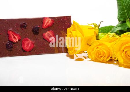 Chocolate bar with fruits on a white background. Gift concept. Isolate. Copy space. Stock Photo