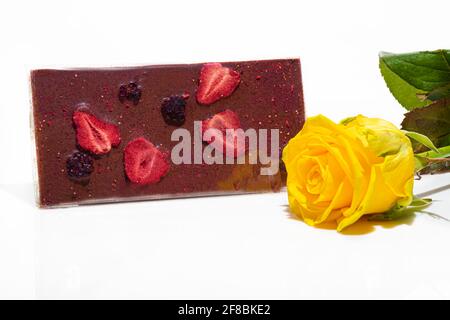 Chocolate bar with fruits on a white background. Gift concept. Isolate. Copy space. Stock Photo