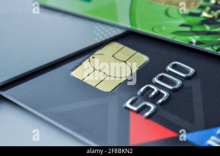 Credit cards and smart chip with shallow depth of field. Macro shot. E-commerce and cashless payment concept. Stock Photo