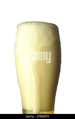 Glass of light beer with foam isolated on a white background. Long exposure. Stock Photo