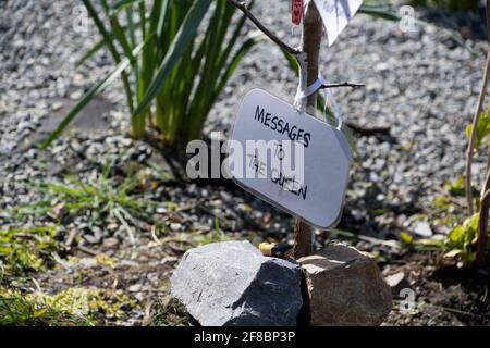Fishguard  , Pembrokeshire , Wales, UK.12 April 2021  Locals Leave condolence messages to the Queen  on the wishing tree  messages  of  hope Left  on tags and  stones on the Passing of  Duke of Edinburgh Credit: Debra Angel/Alamy Live News Stock Photo