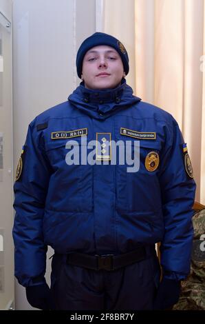Upper part of new Ukrainian police uniform, cold-climate clothing: coat, chevron, police badge, patch with blood type. October 7, 2018. Kiev, Ukraine Stock Photo
