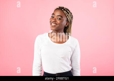 Portrait of smiling young friendly black woman Stock Photo