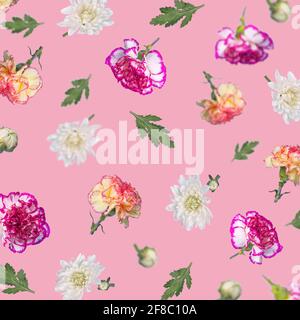 Beautiful spring or summer pattern made with various flying flowers and leaves on pastel pink background, trendy floral layout. Creative Minimal conce Stock Photo