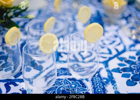 Navy blue and yellow table setting for outdoor wedding reception Stock Photo