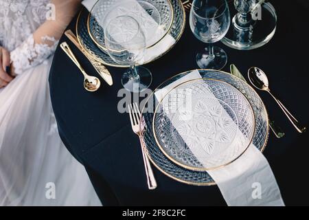 Navy blue and yellow table setting for outdoor wedding reception Stock Photo