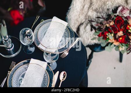 Navy blue and yellow table setting for outdoor wedding reception Stock Photo