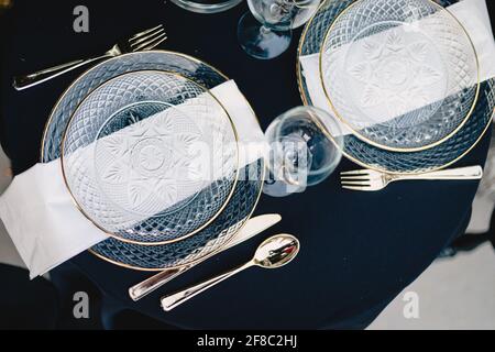 Navy blue and yellow table setting for outdoor wedding reception Stock Photo