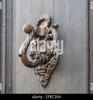 Antique handle on the museum door in Sitges, a city in Spain at the Mediterranean Sea Stock Photo