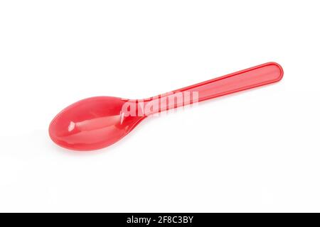 Red plastic spoon isolated on white background Stock Photo