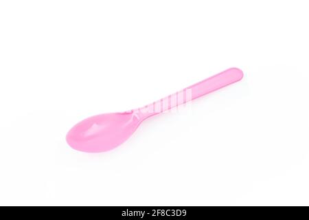 Pink plastic spoon isolated on white background Stock Photo