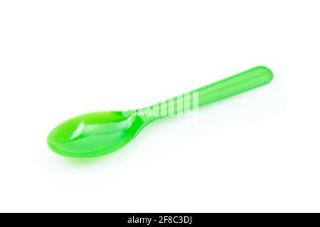 Green plastic spoon isolated on white background Stock Photo