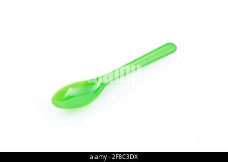 Green plastic spoon isolated on white background Stock Photo