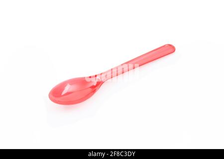 Red plastic spoon isolated on white background Stock Photo