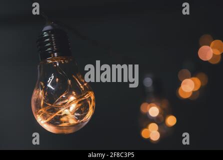 String Light bulbs hanging on a line Stock Photo