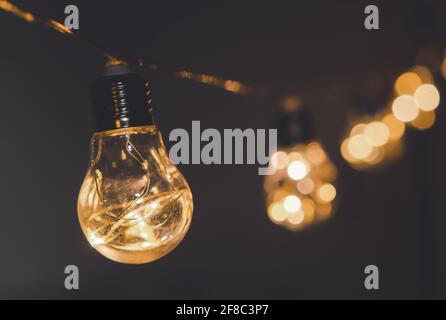 String Light bulbs hanging on a line Stock Photo