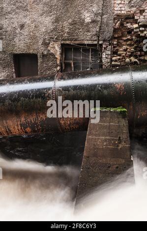 Old pipeline on facade, Sweden Stock Photo