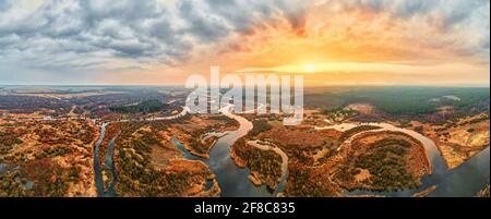 Sunrise over river in walley, aerial view. Nature landscape. Panorama Stock Photo