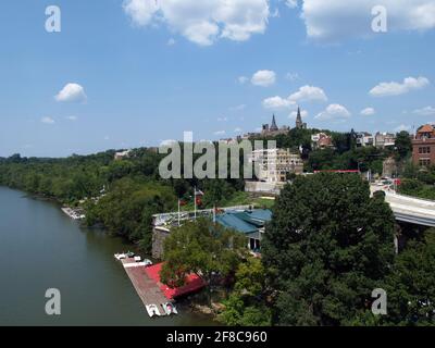 Georgetown University on the horizon creates a scenic view of the waterfront on the Potomac River in Washington DC. Stock Photo
