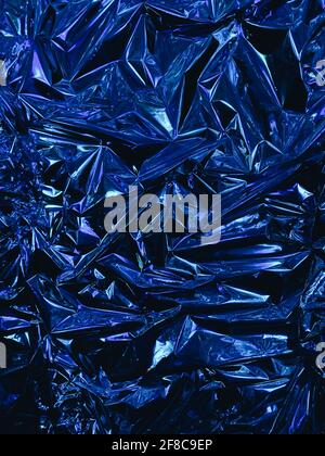 Abstract red and blue aluminum wrinkled foil background texture reflecting  red and blue light Stock Photo - Alamy