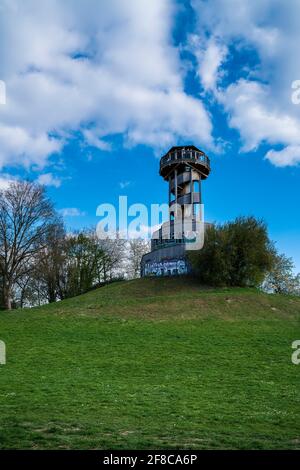 Freiburg im Breisgau, Germany, April 3, 2021, Wooden lookout tower in urban city park seepark on a hill painted with graffiti Stock Photo