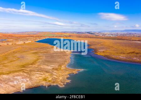 Aerial view about rocky seashore with turquoise waving water. Stock Photo