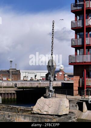 Modern public art work featuring a chain and hook recalls the work of cranes in the docks, Ayr,Scotland,UK Stock Photo