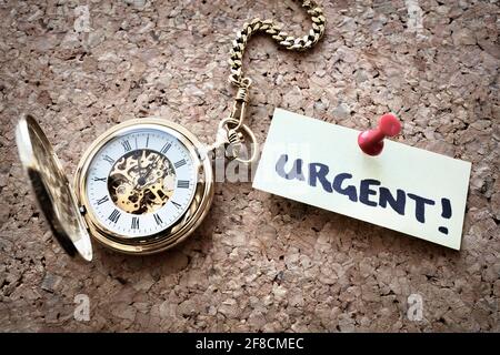 Urgent deadline note and time on pocket watch Stock Photo