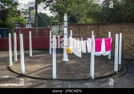 community washing lines on council estate London, council estate communal clothes line Stock Photo