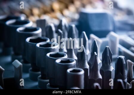 Closeup of different bits set and wrenches close up Stock Photo