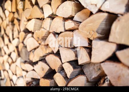 Firewood stack of chopped wood background Stock Photo